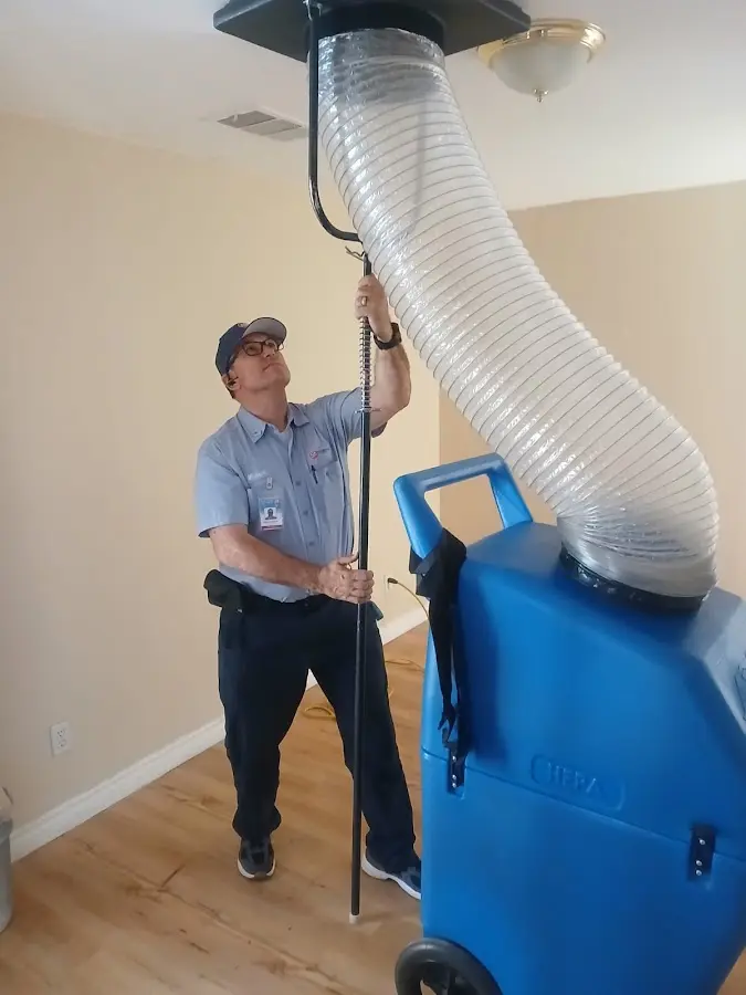 Furnace Tune-Up technician using HEPA equipment in Loudoun Valley Estates